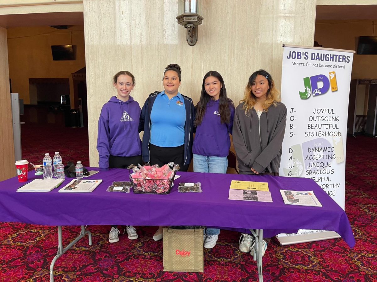 Shayne Santos (second from the right) working a fundraiser with Job’s Daughters